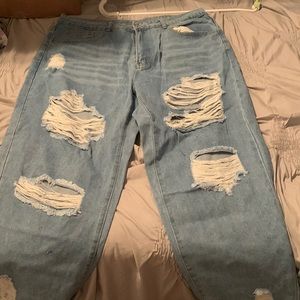 Distressed denim jeans